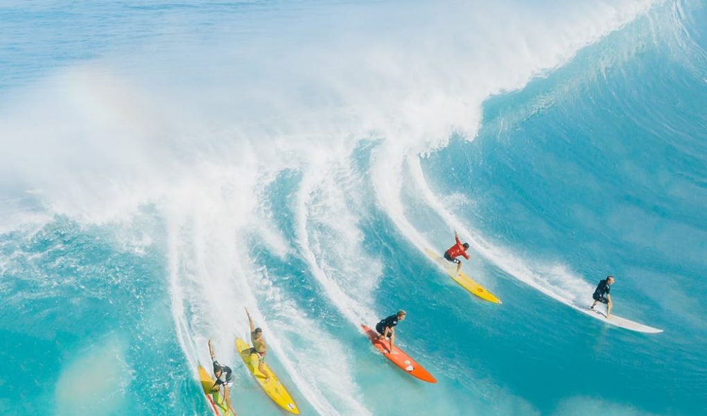 people surfing on sea waves